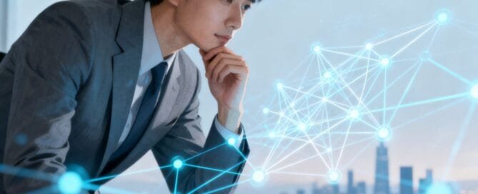 Business person contemplating a complex network of lines and nodes.