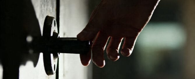 Hand reaching for a hidden lever