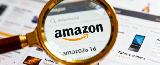 Magnifying glass over blurred Amazon product listings.