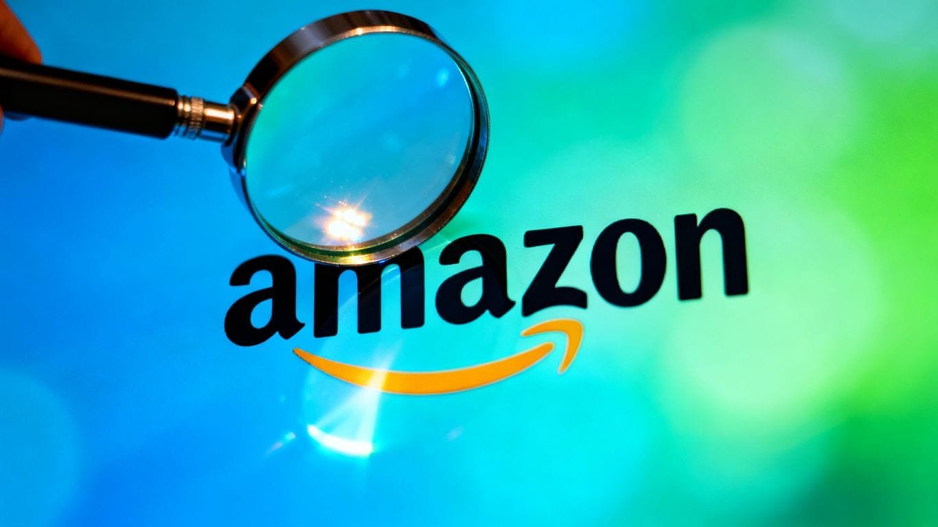 Magnifying glass over Amazon logo, symbolizing SEO.